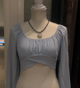 Photo of the D&A Dahlia Off Shoulder Lantern Sleeve Crop Top Baby Blue.