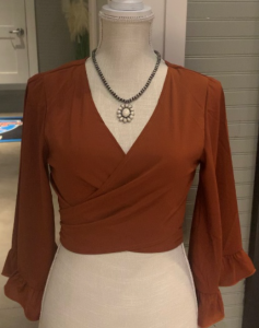 Photo of the D&A Marigold Butterfly Sleeve Tie Front Back Shirt Rust.